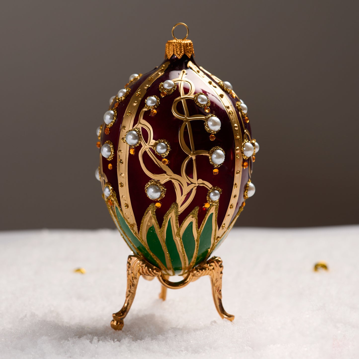 RED FABERGÉ EGG WITH LILY OF THE VALLEY PATTERN